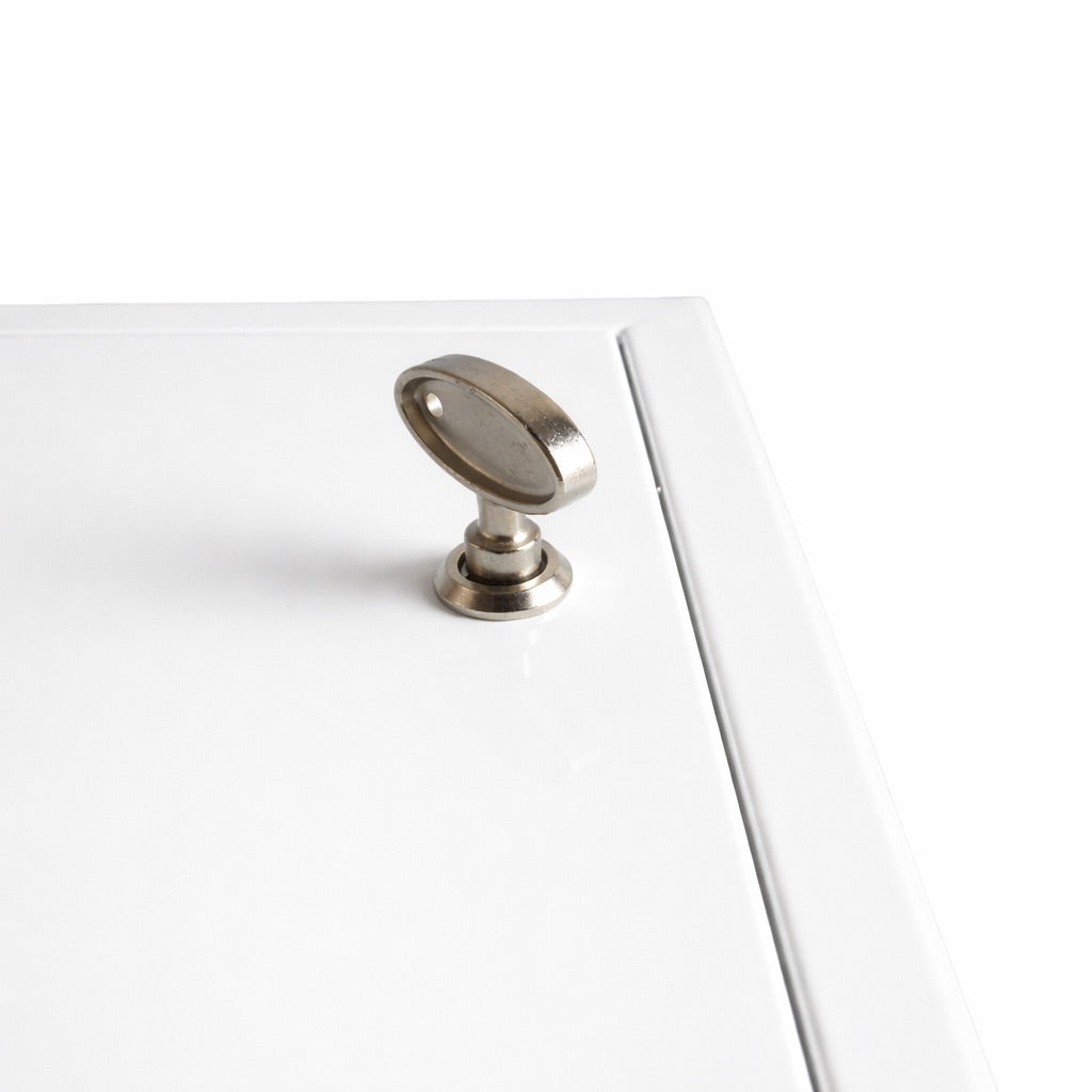 Metal cabinet knob on a white background